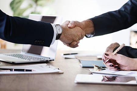 Two Business Professionals Shaking Hands