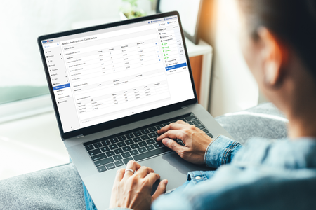 User on Laptop with Benefits Election Screen
