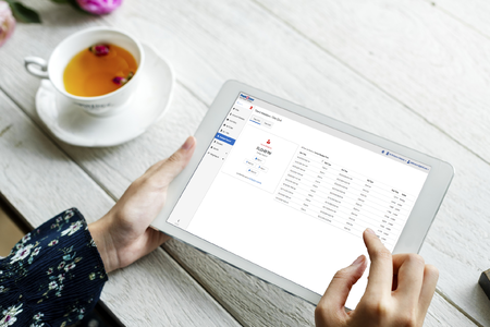 User on Tablet with Time and Attendance Screen