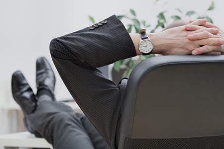 Employee Relaxing at Their Desk
