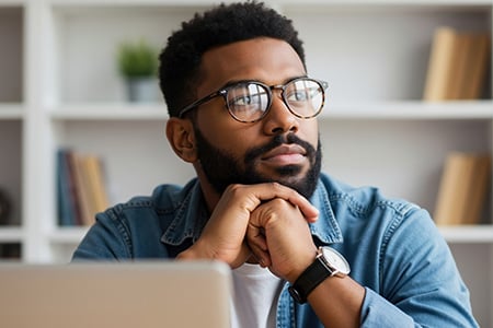 Man at Desk Deep in Thought