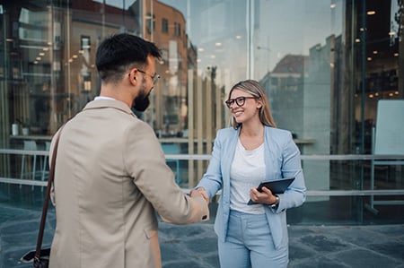 Customer Shaking Hands With a Broker