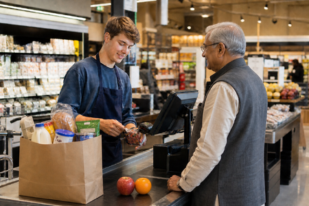 Supermarket Clerk Assisting Elderly Customer at Checkout-3-1