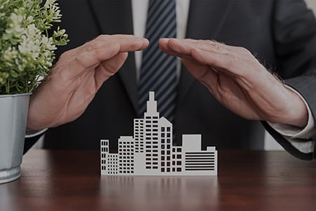 A Business Man Overseeing Office Building Cutouts