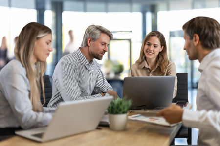 Professionals Engaged In A Meeting