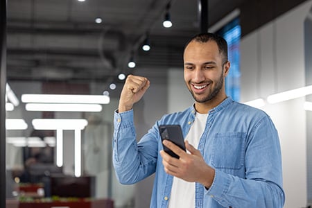 An Employee Being Rewarded Through Their Phone