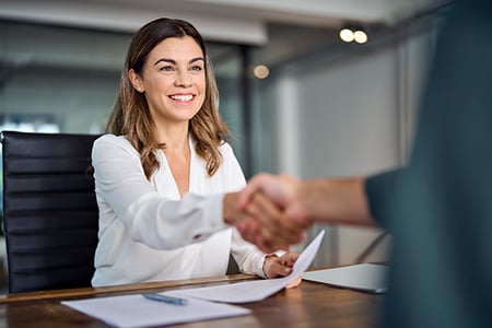 Manager and Broker Shaking Hands